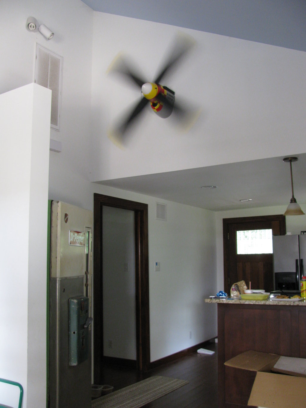 ... ceiling fan - on the wall. That's a vintage Dr.Pepper machine on the